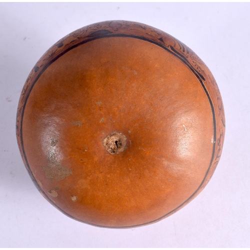 381 - A CHARMING PERUVIAN CARVED AND ENGRAVED SOUTH AMERICAN NUT together with a similar pottery lizard di... 