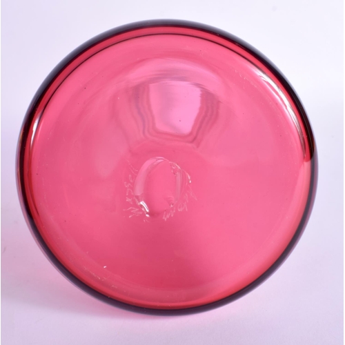383 - A LARGE VINTAGE CRANBERRY GLASS DECANTER with six glasses. Largest 41 cm high. (7)