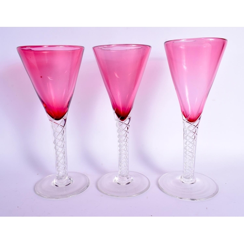 383 - A LARGE VINTAGE CRANBERRY GLASS DECANTER with six glasses. Largest 41 cm high. (7)