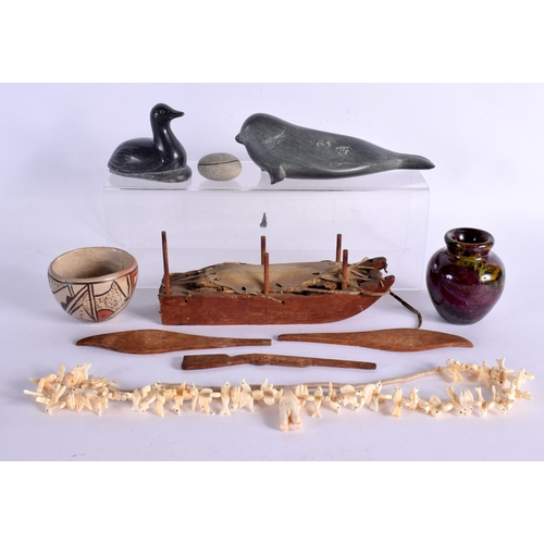 386 - TWO INUIT CARVED STONE FIGURES OF ANIMALS together with a whale bone necklace etc. (6)
