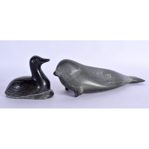 386 - TWO INUIT CARVED STONE FIGURES OF ANIMALS together with a whale bone necklace etc. (6)