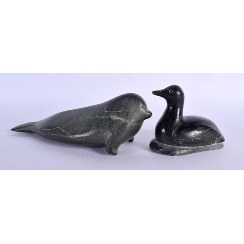 386 - TWO INUIT CARVED STONE FIGURES OF ANIMALS together with a whale bone necklace etc. (6)
