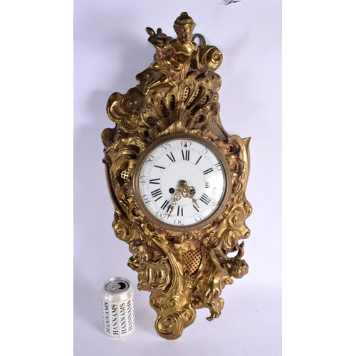 390 - A LARGE 19TH CENTURY FRENCH GILT BRONZE HANGING CARTEL CLOCK decorated with figures in various pursu... 