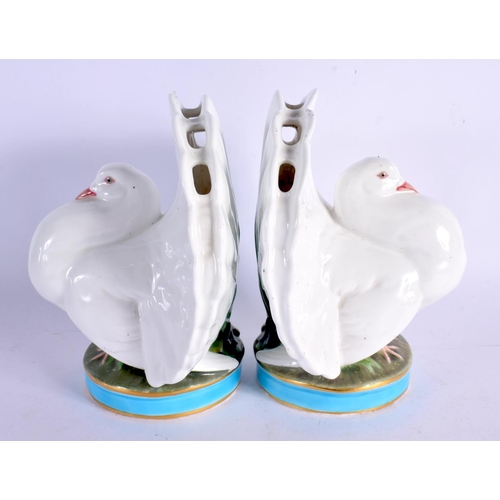 391 - A RARE PAIR OF 19TH CENTURY MINTON PORCELAIN POSY HOLDERS formed as seated doves. 16 cm x 12 cm.