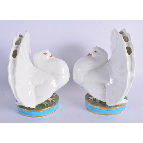 391 - A RARE PAIR OF 19TH CENTURY MINTON PORCELAIN POSY HOLDERS formed as seated doves. 16 cm x 12 cm.