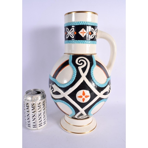 395 - A STYLISH ARTS AND CRAFTS DRESSER STYLE POTTERY JUG decorated with motifs. 34 cm x 14 cm.