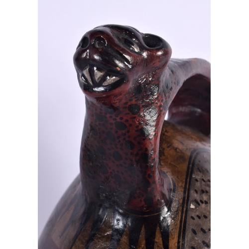 396 - A SOUTH AMERICAN PAINTED PERUVIAN CUSCO POTTERY EWER painted with cats and motifs. 26 cm high.