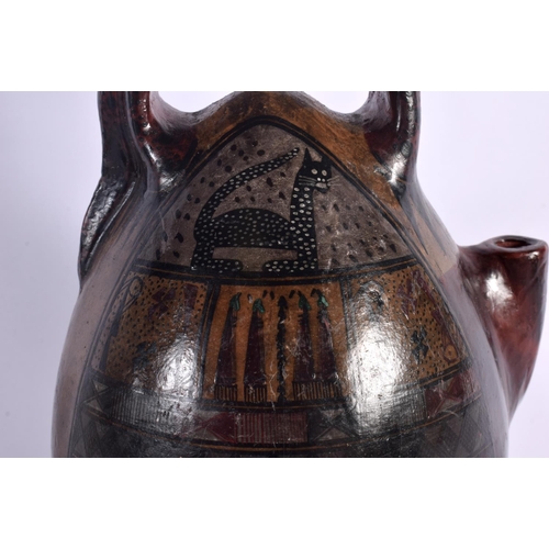 396 - A SOUTH AMERICAN PAINTED PERUVIAN CUSCO POTTERY EWER painted with cats and motifs. 26 cm high.