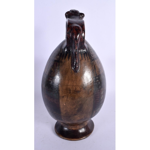 396 - A SOUTH AMERICAN PAINTED PERUVIAN CUSCO POTTERY EWER painted with cats and motifs. 26 cm high.