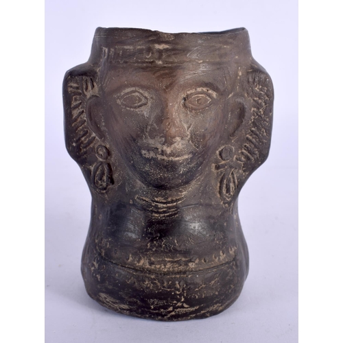 397 - A SOUTH AMERICAN POTTERY VESSEL modelled as a female. 11 cm x 8 cm.