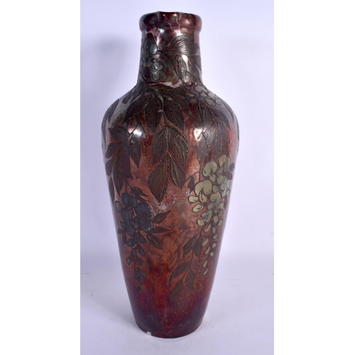 405 - A LARGE ART NOUVEAU FRENCH POTTERY EWER overlaid with trailing berries and vines. 40 cm x 15 cm.