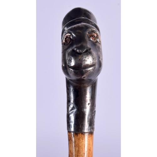 406 - A RARE ANTIQUE SILVER MOUNTED MONKEY HEAD SWAGGER STICK. 80 cm long.