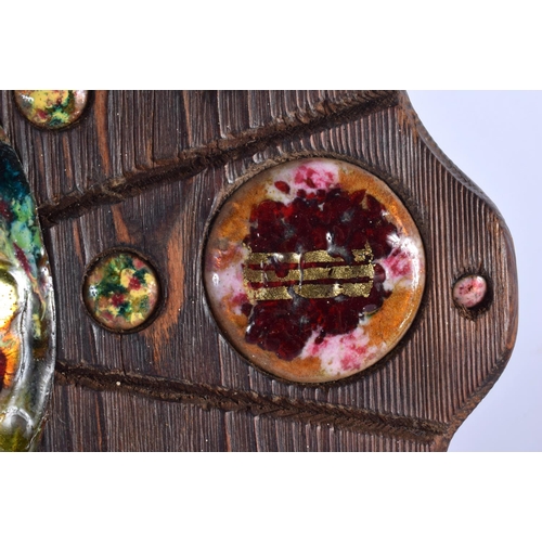 408 - A VERY RARE EARLY 20TH CENTURY CARVED WOOD AND ENAMEL MANTEL CLOCK set with numerous roundels. 34 cm... 