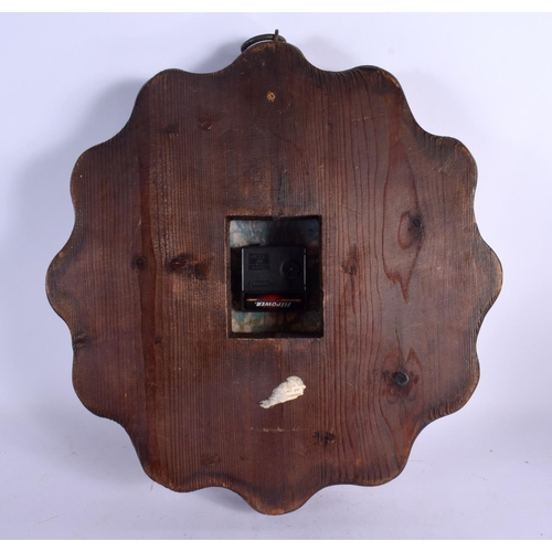 408 - A VERY RARE EARLY 20TH CENTURY CARVED WOOD AND ENAMEL MANTEL CLOCK set with numerous roundels. 34 cm... 