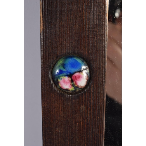 409 - A VERY SIMILAR EARLY 20TH CENTURY CARVED WOOD AND ENAMEL MIRROR inset with numerous roundels. 42 cm ... 