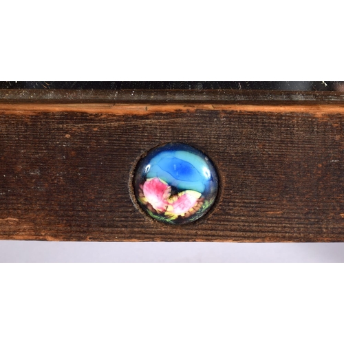 409 - A VERY SIMILAR EARLY 20TH CENTURY CARVED WOOD AND ENAMEL MIRROR inset with numerous roundels. 42 cm ... 