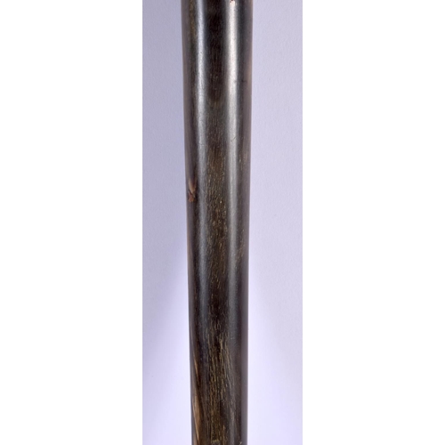 415 - A 19TH CENTURY MIDDLE EASTERN CARVED RHINOCEROS HORN SHOE HORN SWAGGER STICK with hoof terminal. 60 ... 