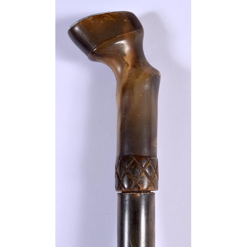 415 - A 19TH CENTURY MIDDLE EASTERN CARVED RHINOCEROS HORN SHOE HORN SWAGGER STICK with hoof terminal. 60 ... 