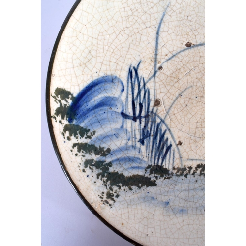 48 - A RARE EARLY 18TH/19TH CENTURY JAPANESE EDO MINGEI SETO POTTERY DISH painted with sparse foliage and... 