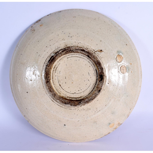 48 - A RARE EARLY 18TH/19TH CENTURY JAPANESE EDO MINGEI SETO POTTERY DISH painted with sparse foliage and... 