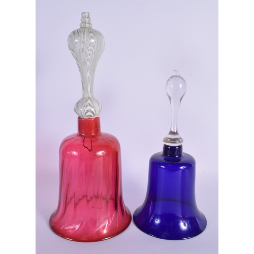57 - A PAIR OF BOHEMIAN BLUE FLASH DECANTERS with stoppers  together with a vase & bells. Largest 34 cm h... 