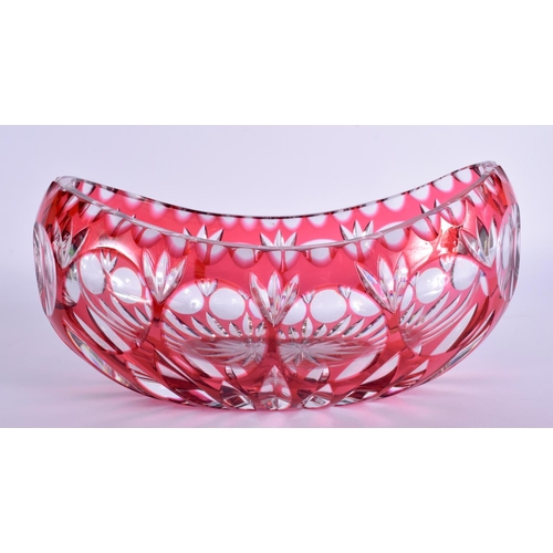 57 - A PAIR OF BOHEMIAN BLUE FLASH DECANTERS with stoppers  together with a vase & bells. Largest 34 cm h... 