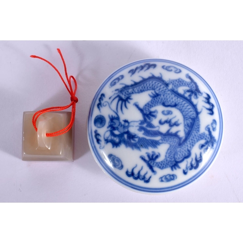 60 - AN EARLY 20TH CENTURY CHINESE CARVED SOAPSTONE SEAL together with a paste box. (2)