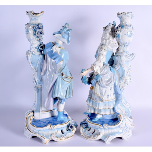 8 - A GOOD LARGE PAIR OF 19TH CENTURY GERMAN BLUE AND WHITE PORCELAIN FIGURES modelled as a female and f... 