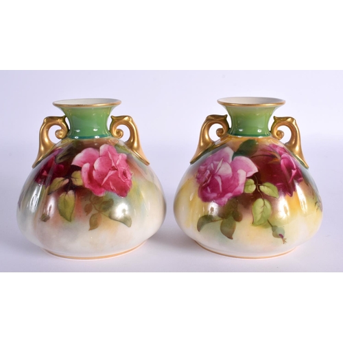 114 - A PAIR OF ROYAL WORCESTER TWIN HANDLED VASES. 9 cm x 7 cm.