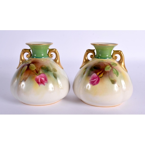 114 - A PAIR OF ROYAL WORCESTER TWIN HANDLED VASES. 9 cm x 7 cm.