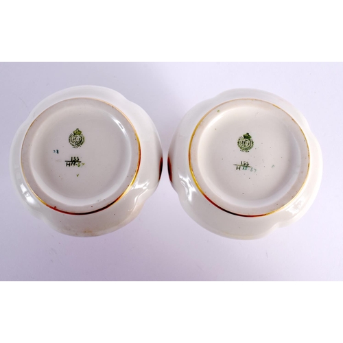 114 - A PAIR OF ROYAL WORCESTER TWIN HANDLED VASES. 9 cm x 7 cm.