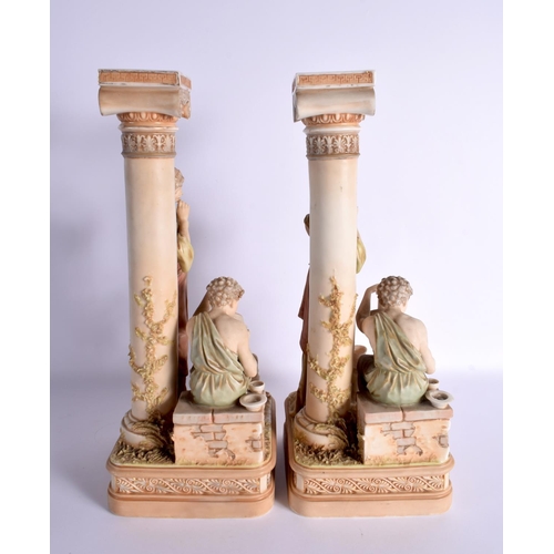 115 - A LARGE PAIR OF AUSTRIAN ROYAL DUX BISQUE PORCELAIN CANDLESTICKS. 42 cm x 15 cm.