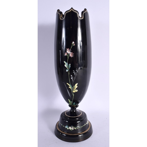 12 - A VICTORIAN BLACK OPALINE GLASS VASE enamelled with flowers. 33 cm high.