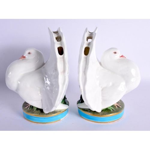 120 - A RARE PAIR OF 19TH CENTURY MINTON PORCELAIN POSY HOLDERS formed as seated doves. 16 cm x 12 cm.