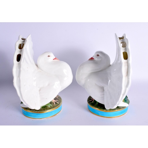 120 - A RARE PAIR OF 19TH CENTURY MINTON PORCELAIN POSY HOLDERS formed as seated doves. 16 cm x 12 cm.