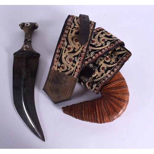 121 - AN ANTIQUE MIDDLE EASTERN CARVED RHINOCEROS HORN OMANI JAMBIYA DAGGER with wire work mounts. Dagger ... 