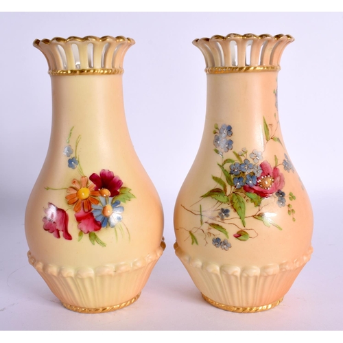 135 - Royal Worcester pair of pierced neck vases shape G1061 painted with flowers on a blush ivory ground ... 