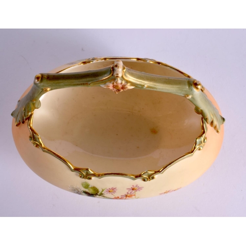 139 - Royal Worcester oval basket shape 1954 painted with wild flowers on a blush ivory ground date mark 1... 