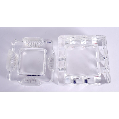 164 - A PAIR OF FRENCH LALIQUE GLASS DISHES. Largest 11 cm square.