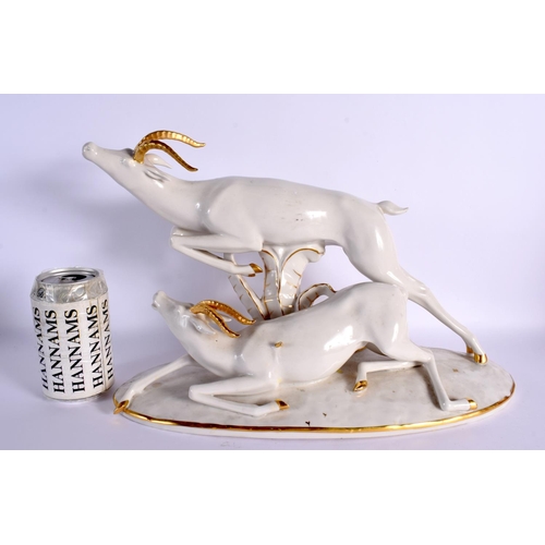 165 - A LARGE ART DECO GERMAN PORCELAIN FIGURE. 34 cm x 22 cm.