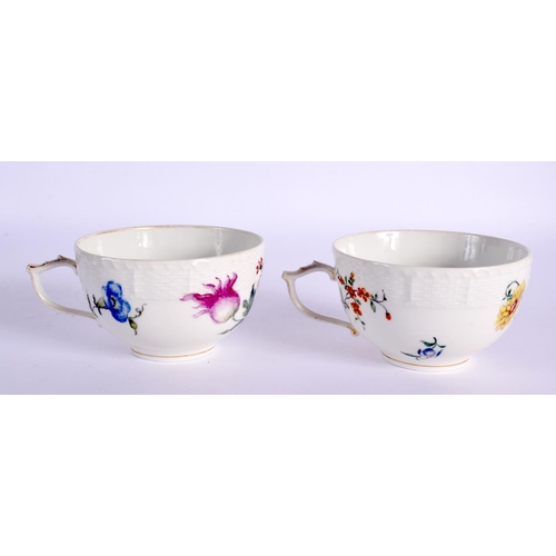 171 - 18th c. Berlin teacups and saucers, painted with colourful flowers below an ozier moulded border, sc... 