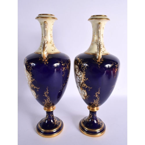 174 - Early 20th century Coalport pair of landscape vases painted by P. Simpson. Signed. 32.5cm High