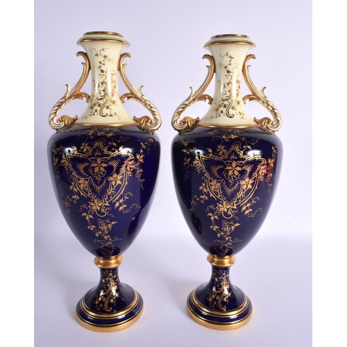 174 - Early 20th century Coalport pair of landscape vases painted by P. Simpson. Signed. 32.5cm High