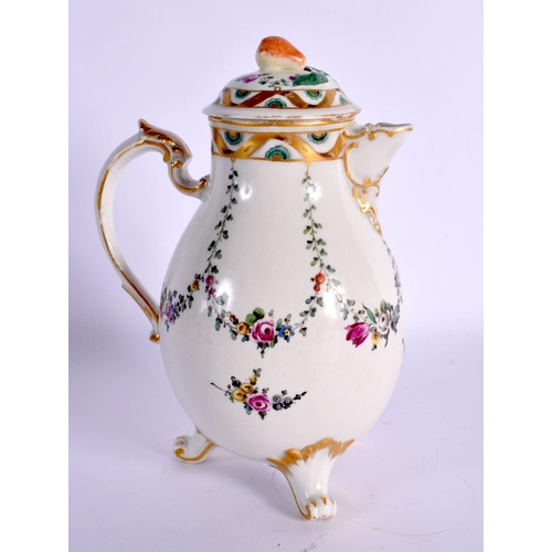 179 - 18th c, Ludwigsburg three footed jug and cover painted with swags of flowers. 14cm High