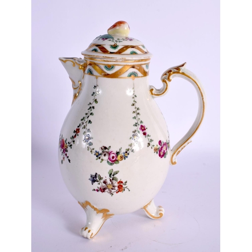 179 - 18th c, Ludwigsburg three footed jug and cover painted with swags of flowers. 14cm High