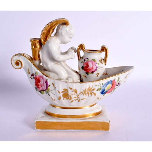 183 - 19th century Paris porcelain inkwell modelled with a winged cherub seated before a two handled vase ... 