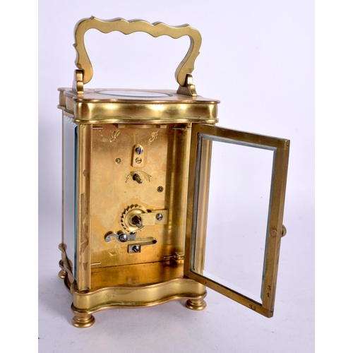 240 - A FRENCH BRASS CARRIAGE CLOCK. 15 cm high inc handle.