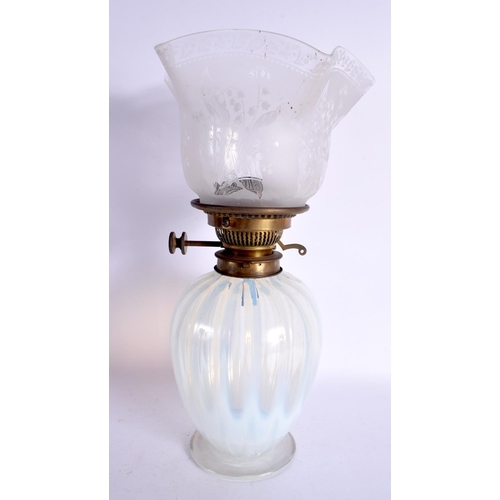 254 - AN ANTIQUE VASELINE LAMP. 40 cm high.