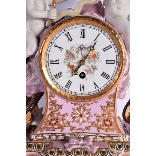 29 - A LARGE CONTINENTAL PINK AND BISQUE PORCELAIN MANTEL CLOCK embellished with flowers and vines. 42 cm... 