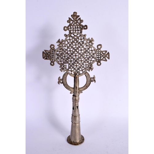 300 - A 19TH CENTURY MIDDLE EASTERN ARABIC SILVERED ALLOY ALLAH STANDARD of tapering form. 30 cm x 12 cm.